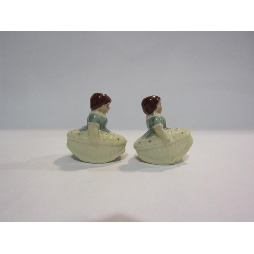 4333 - A pair of rocking girl miniature porcelain tapersticks, 5cm tall