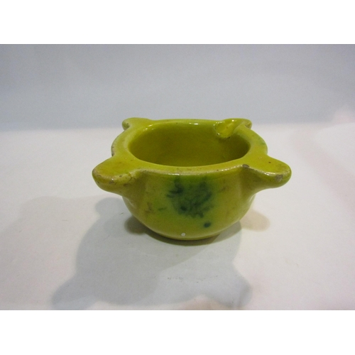 4335 - A Spanish yellow glazed pottery mortar, 16cm diameter.