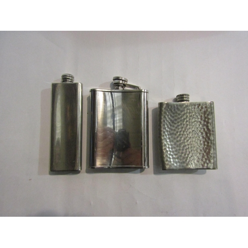 4357 - Three white metal hip flasks, one marked Charles Renne Mackintosh, pewter