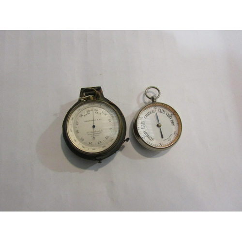 4383 - A brass cased pocket aneroid barometer, with altitude ring, by Callaghan & Co, London 6.5cm diameter... 