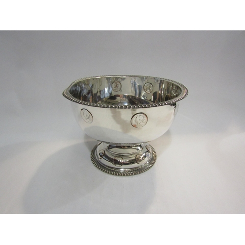 4404 - A white metal punch bowl inset with coin detail, gadrooned edge on pedestal base, 25cm diameter    (... 