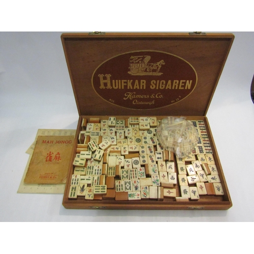 4430 - A bone and bamboo Mah Jong set housed in a cigar box