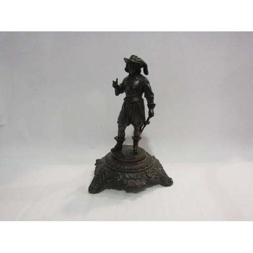 4439 - A metal figure of 16th Century man on plinth, marked 