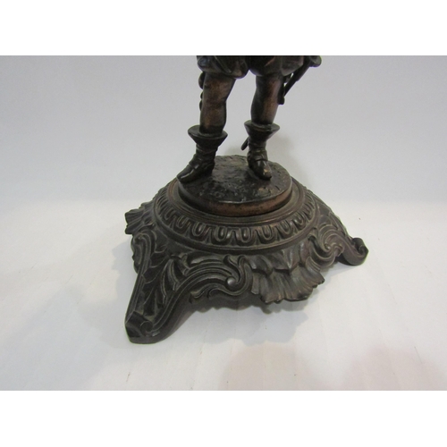 4439 - A metal figure of 16th Century man on plinth, marked 