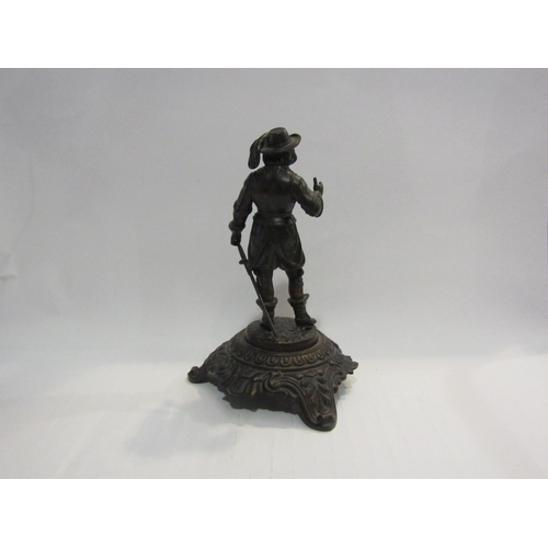 4439 - A metal figure of 16th Century man on plinth, marked 