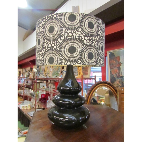 4008 - A modernist black monsoon lamp with black and white shade