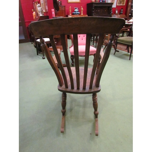 4016 - A Victorian elm seated and lathe back rocking chair  (R)    £60