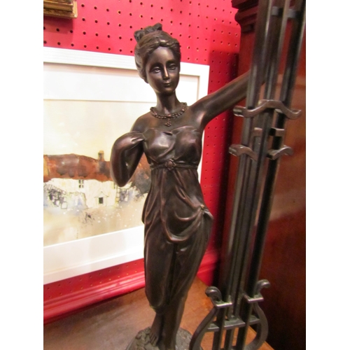 4032 - A modern Juliana figural pendulum clock and a modern Dutch wall clock surmounted by a figure holding... 