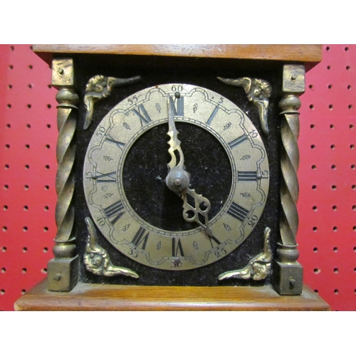 4032 - A modern Juliana figural pendulum clock and a modern Dutch wall clock surmounted by a figure holding... 