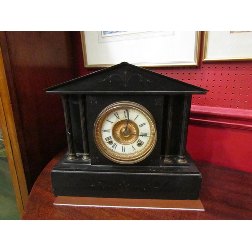 4044 - A Neo-Classical black slate mantel clock with reeded column supports, with pendulum, no key