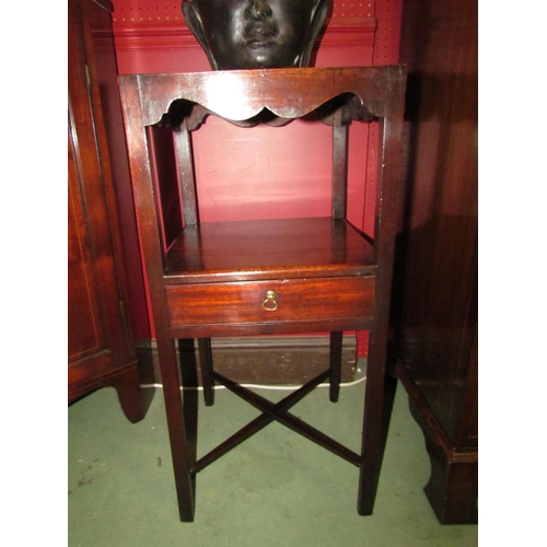 4064 - A George III mahogany two tier gentlemans washstand with shaped apron over a single drawer and 'X' f... 