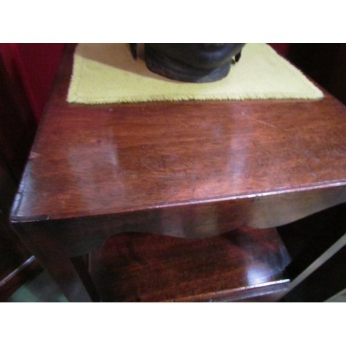 4064 - A George III mahogany two tier gentlemans washstand with shaped apron over a single drawer and 'X' f... 