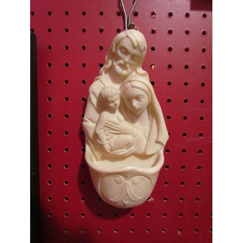 4067 - A religious holy water wall pocket, 18cm high