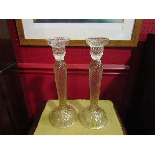 4069 - A pair of slender faceted form candlesticks, 31cm tall  (R)   £10