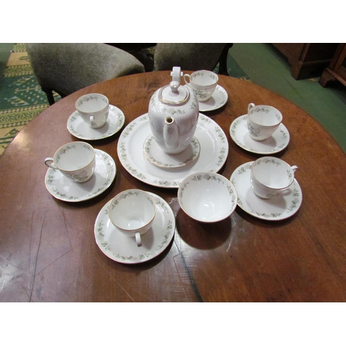 4076 - A part tea/coffee service comprising of teapot, milk jug, sugar bowls, coffee pot, tea and coffee cu... 