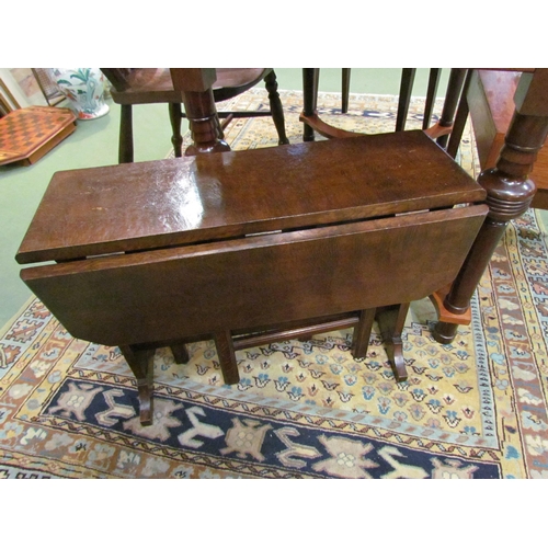 4121 - An Edwardian oak gateleg table of small proportions, pierced side splats, 48cm high  (R)   £35