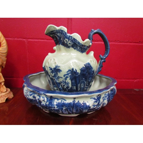 4139 - A blue and white jug and bowl and two oriental resin figures