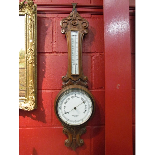 4161 - An AWG & Mage Ltd., London, carved oak barometer with mercury thermometer