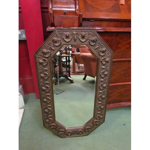 4167 - A metal framed octagonal bevel edge wall mirror embossed with Rococo shell form motifs, 74cm high x ... 