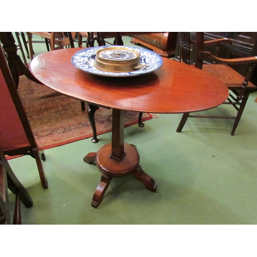 4176 - A pair of Arts & Crafts mahogany lamp tables the chamfered edge oval tops over tapering square colum... 