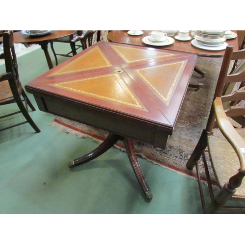 4187 - A reproduction envelope table with leather inserts, pedestal base with reeded legs, paw feet to cast... 