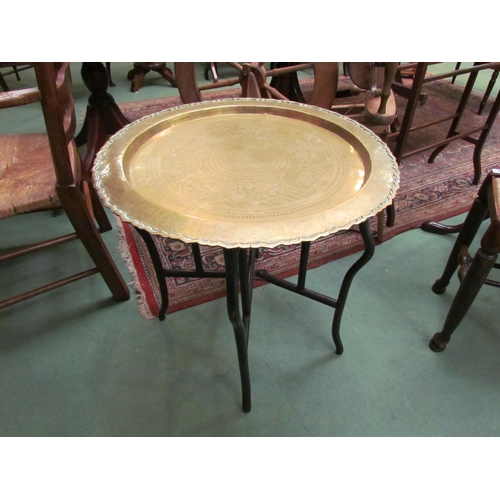 4190 - An Eastern brass top folding table