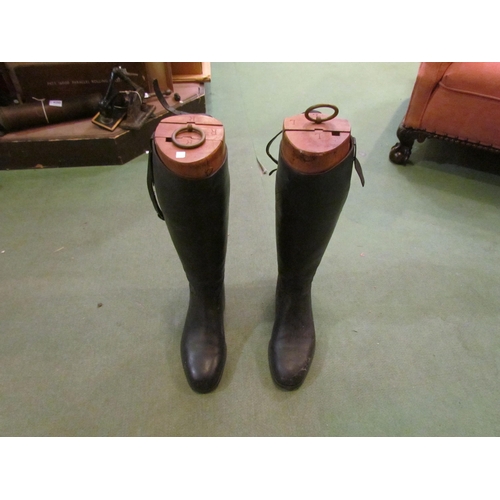 4201 - A pair of black riding boots and wooden boot trees