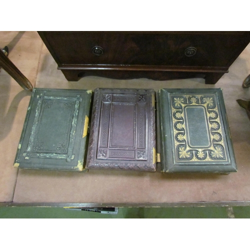 4235 - Three leather bound Victorian photograph albums, some with contents to include royalty