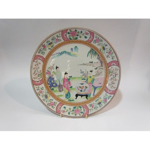 4273 - A Japanese polychrome porcelain plate with central figural scene, floral borders, 30.5cm diameter.