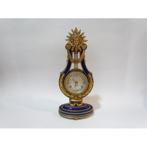 4292 - A reproduction Marie Antoinette lyre clock, blue glazed porcelain with gilt metal mounts, V & A Muse... 