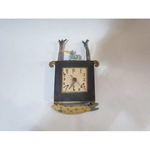 4320 - KATE BRETT: A surreal wall clock surmounted by a bird with hanging fish beneath, approximately 26cm ... 