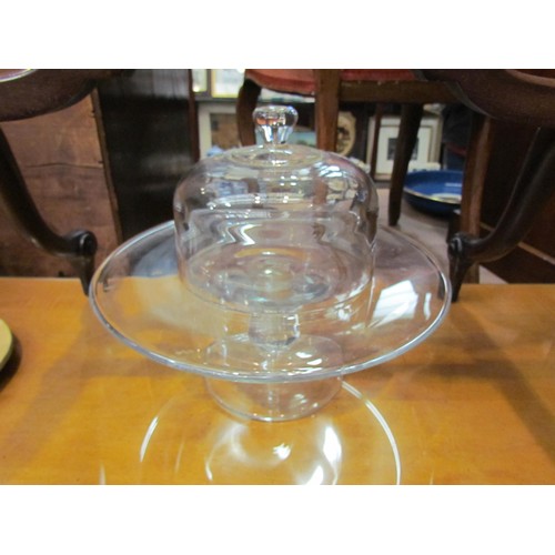 4215 - A glass pedestal cake stand with bulbous stem and a glass dome (2)