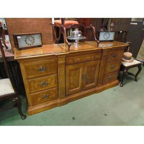 4216 - A Georgian style crossbanded breakfront buffet sideboard of nine drawers over a plinth base, two cup... 