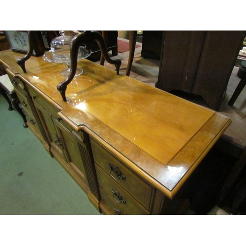 4216 - A Georgian style crossbanded breakfront buffet sideboard of nine drawers over a plinth base, two cup... 