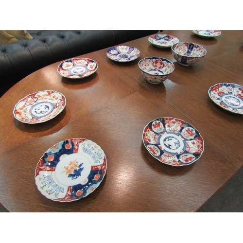 1013 - Ten Japanese Imari plates and two bowls, one with character marks to base and some a/f