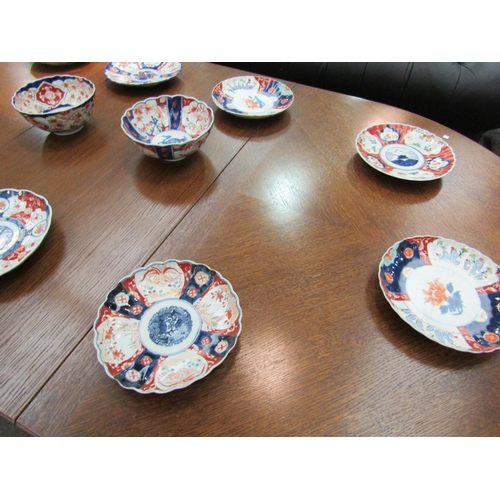 1013 - Ten Japanese Imari plates and two bowls, one with character marks to base and some a/f