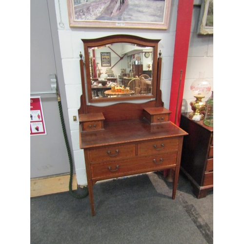 1074 - An Edwardian mahogany and satinwood crossbanded dressing chest, the mirror back over two jewellery d... 