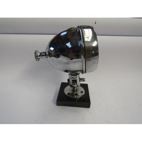 9056 - A chromed Miller lamp with bracket mounted on plinth