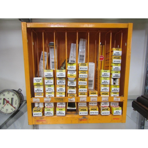 9072 - A spark plug display holder containing a quantity of boxed NGK spark plugs