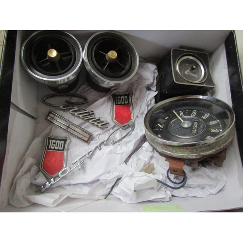 9081 - A box of Cortina spares including speedo, badges, etc