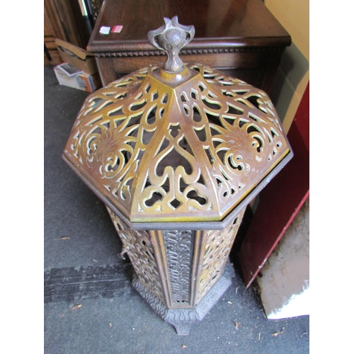 1001 - A Victorian enamelled cast iron floor standing heater with decorative floral detailing, lid with fin... 