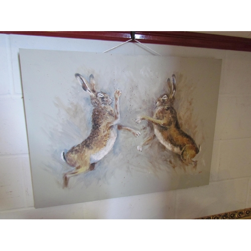 1005 - JOHN RYAN: An acrylic of boxing hares, signed lower right, 60cm x 80cm