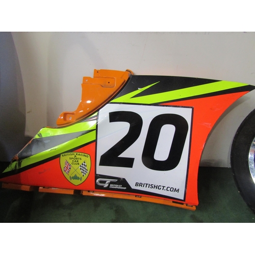 9025 - A racing car body panel with advertising stickers from a McLaren