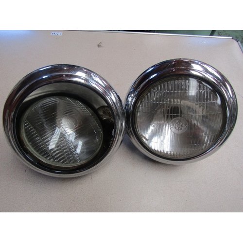 9060 - A pair of chromed Lucas type M150 headlamps with reducer rims