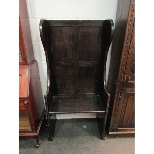 1021 - An early 20th Century oak small tavern settle with panelled backrest, 137cm high x 72cm wide x 36cm ... 