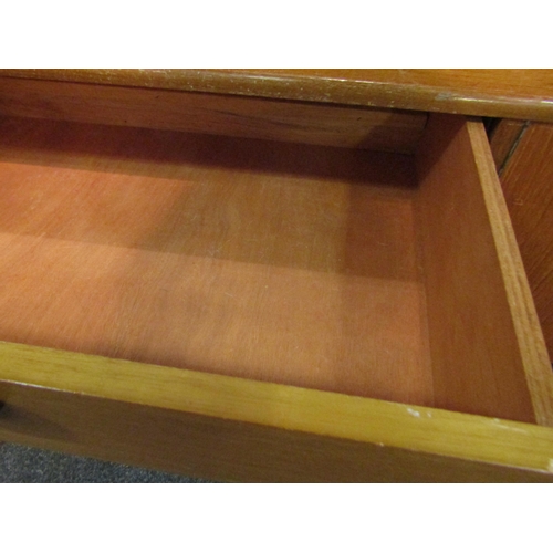 1036 - A retro 1960’s teak sideboard with glazed display section, drop-flap, four drawers and two cupboard ... 