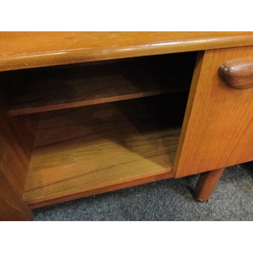 1036 - A retro 1960’s teak sideboard with glazed display section, drop-flap, four drawers and two cupboard ... 