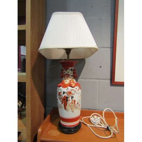 1037 - A Japanese design table lamp with scene of girls by lakeside with mountains to background, applied d... 