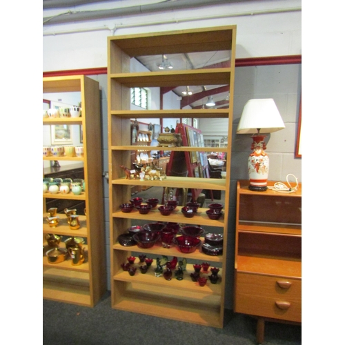 1038 - A light oak mirror back shelving unit, 227cm high x 97cm wide x 20cm deep   (R) £10