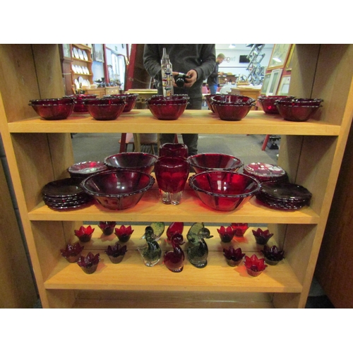 1041 - A collection of Cranberry glass including bowls, dishes, vase and candle holders with three duck fig... 